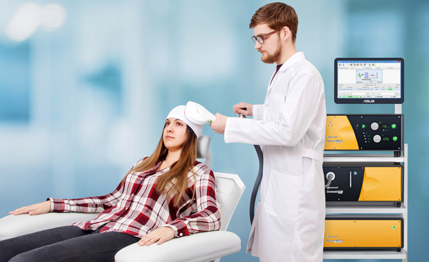 Doctor is giving TMS Treatment to paitent